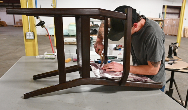 Employee Assembling Wooden Chair
