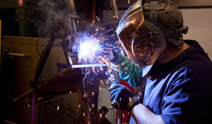 Employee Welding Metal Chair Frame