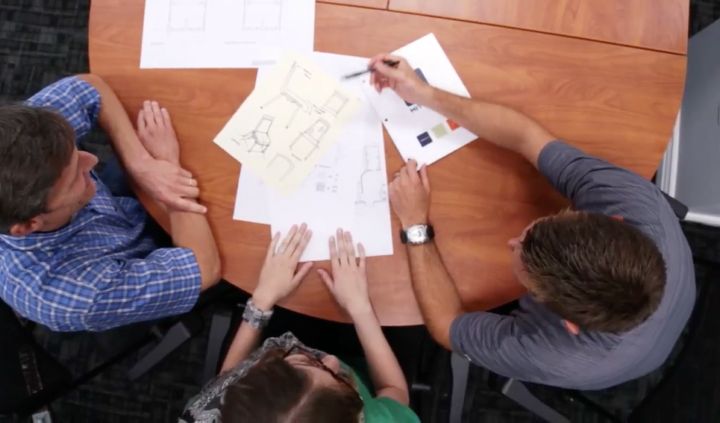 Overhead View Of 3 Employees Collaborating