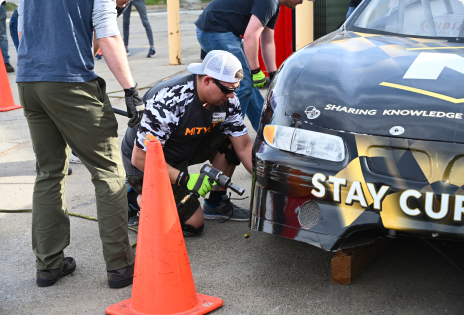 Employees Competing At Pit Crew Challenge